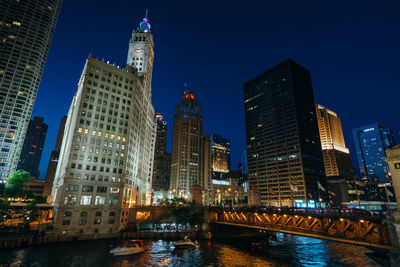 Illuminated buildings in city at night