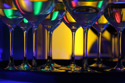 Close-up of wine glasses on table