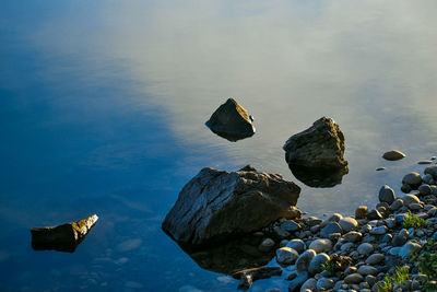 Rocks on beach against sky