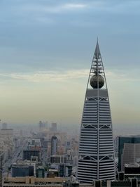 Buildings in city against sky