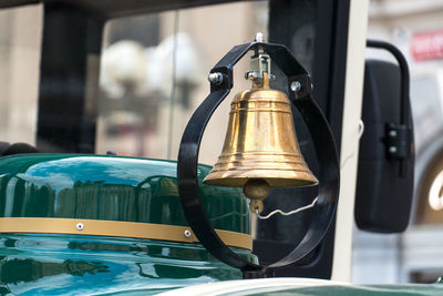 Gold pendant bell hanging, close-up