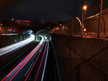 High angle view of light trails on road at night