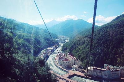 High angle view of overhead cable car against mountains