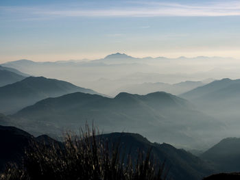 Scenic view of mountains against sky during sunset