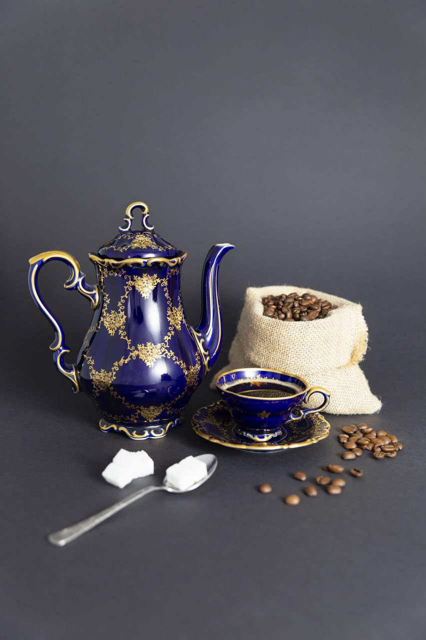 CLOSE-UP OF TEA CUP ON TABLE