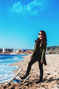 High angle view of woman standing on beach