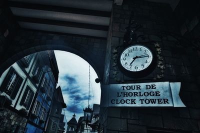 Low angle view of clock tower against sky