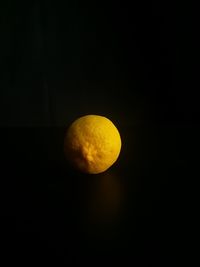 Close-up of apple against black background