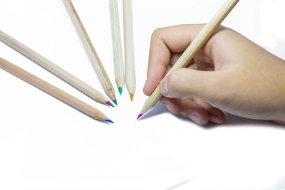 Close-up of hand holding painting