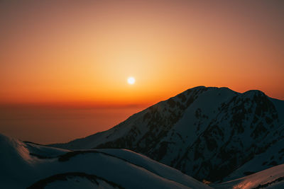 Scenic view of mountains against sky during sunset