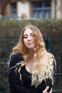 Smiling young woman with blond hair