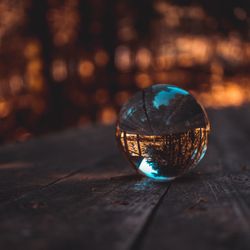 Close-up of crystal ball on table