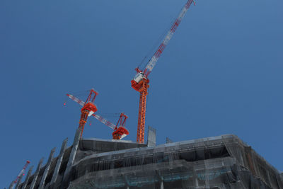 Low angle view of statue against clear blue sky