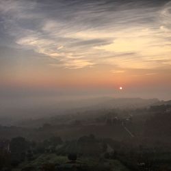 Scenic view of landscape at sunset