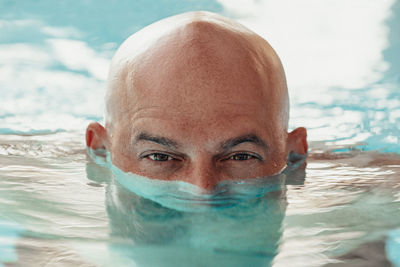 Portrait of man in swimming pool