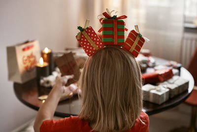 Rear view of boy wearing christmas headband