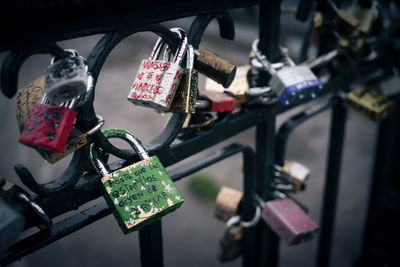 Close-up of padlocks on railing