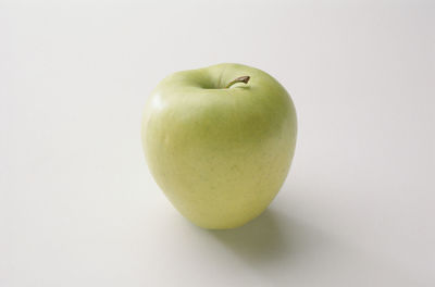Close-up of apple against white background