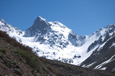 Scenic view of mountains against cloudy sky