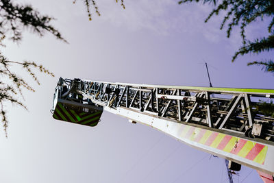 Low angle view of information sign against sky