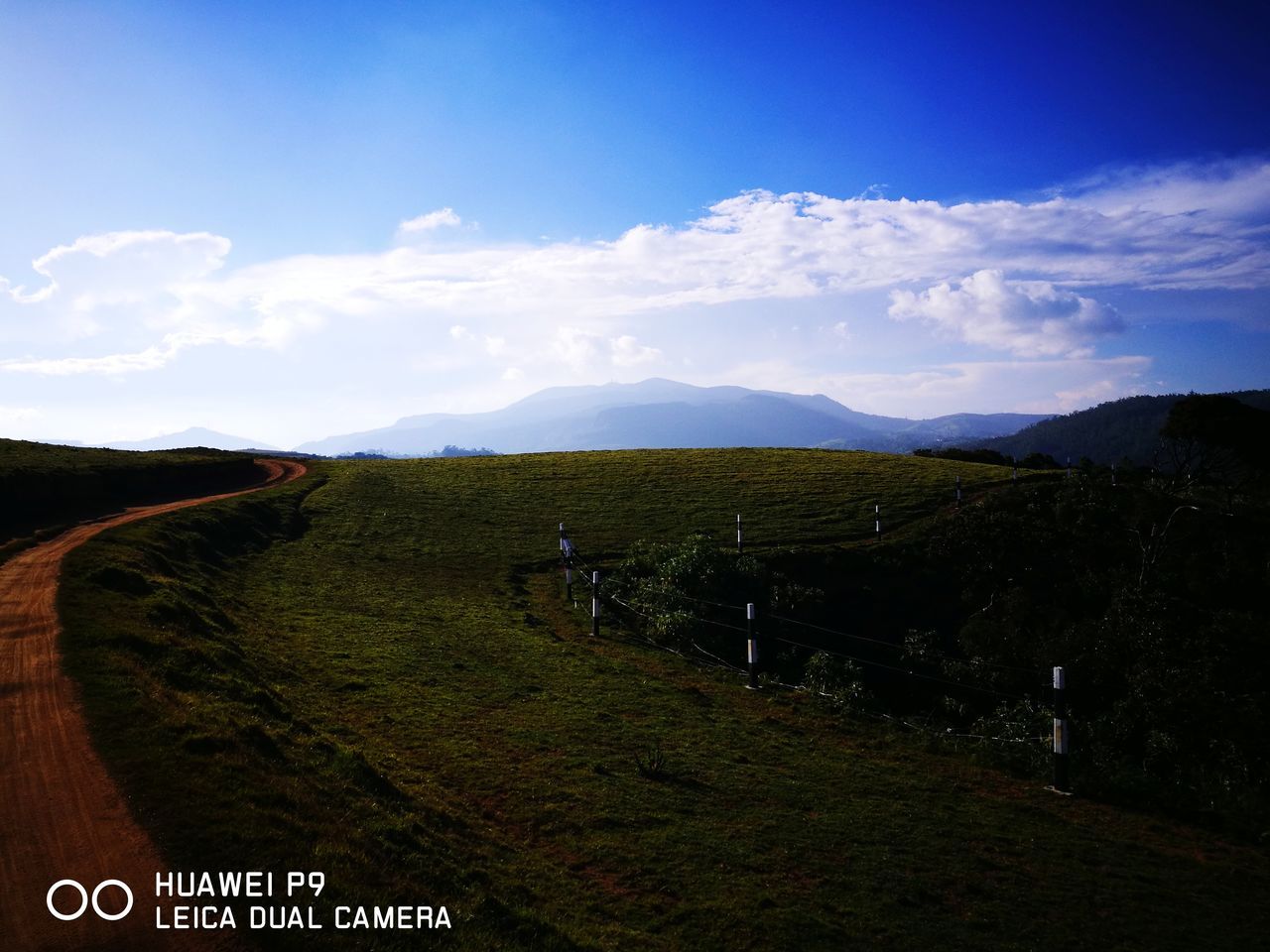 cloud - sky, sky, landscape, scenics, beauty in nature, nature, tranquil scene, text, grass, tranquility, hill, field, outdoors, day, no people