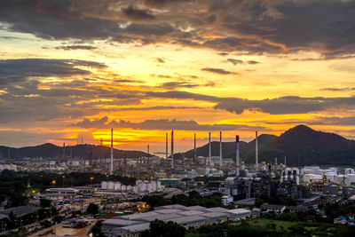 High angle view of buildings in city during sunset