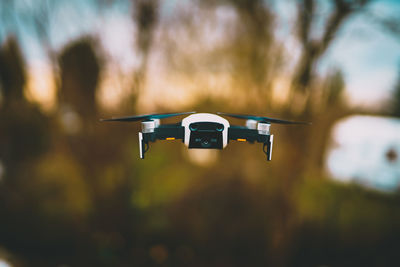 Close-up of airplane flying against sky