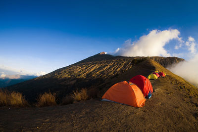 Tent on mountain against sky
