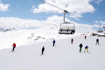 People on snowcapped mountain