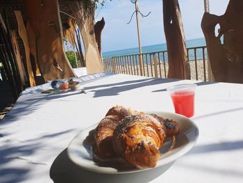 Breakfast on table by sea