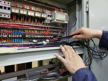 Cropped hands of man working in workshop