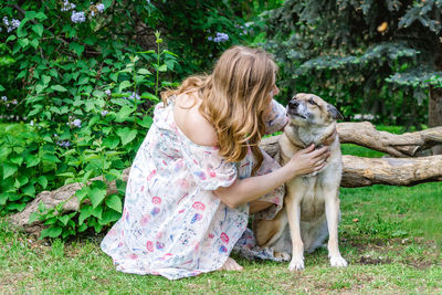 Portrait of beautiful young woman with her dog. gentle relationship between human and dog.