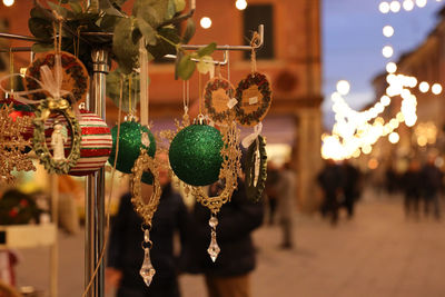 Close-up of christmas lights hanging at night