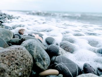 Close-up of pebbles on beach