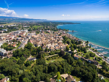 High angle view of townscape by sea