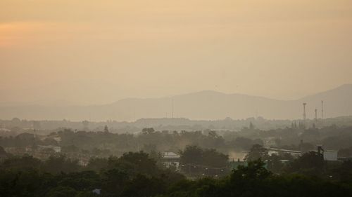 Scenic view of mountains against sky during sunset