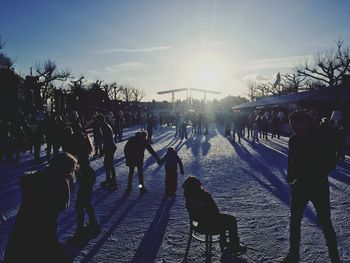 Silhouette of people on sunny day