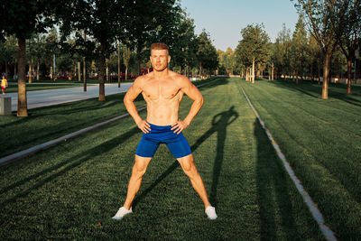 Full length of man exercising on road