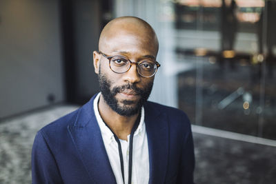 Portrait of male entrepreneur standing in office