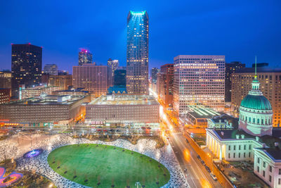 High angle view of illuminated buildings against sky at night