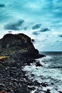 Scenic view of sea against cloudy sky