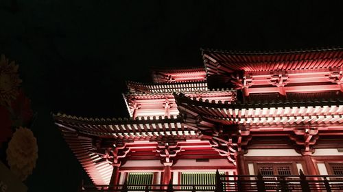 Low angle view of illuminated chinese temple at night