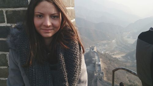 Portrait of woman against great wall of china during winter