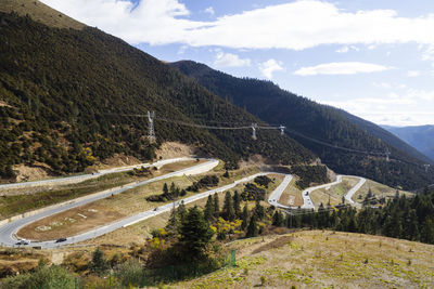 High angle view of road by mountain against sky