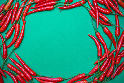 Full frame shot of red chili peppers on table