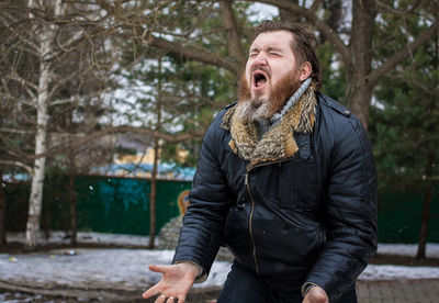 Man standing outdoors during winter