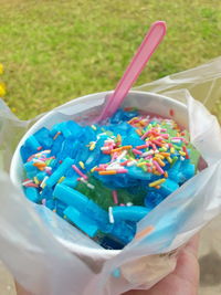 Close-up of hand holding ice cream