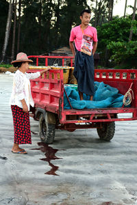 Full length of woman sitting in bus