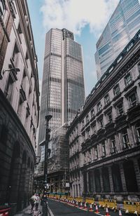 Low angle view of buildings against sky in city