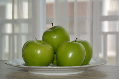 Close-up of fruits in plate on table